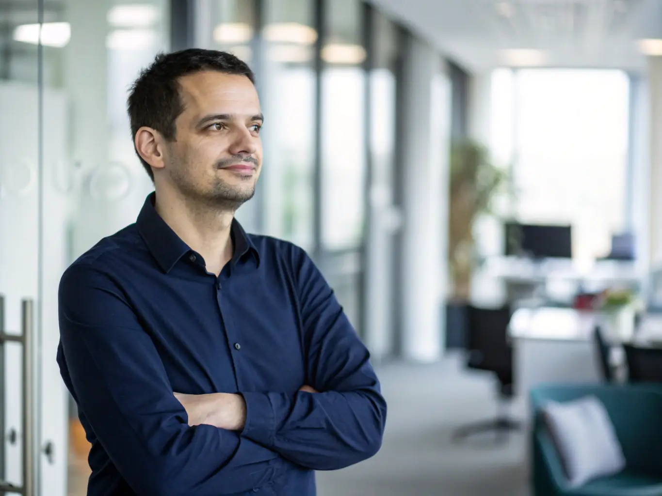 A professional headshot of Kellman Gnanapragasam smiling confidently while engaging in a virtual meeting, showcasing his excellent communication skills.